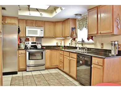 Photo. Spacious kitchen with granite counters, ple