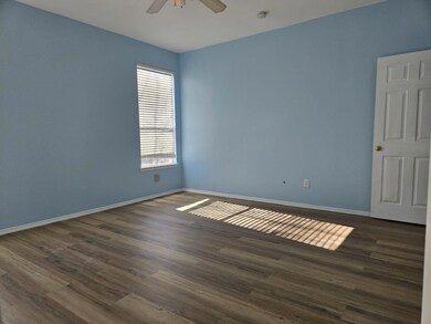 Unfurnished room with dark hardwood / wood-style f