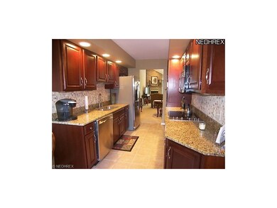 Totally redone kitchen with cherry cabinets, grani