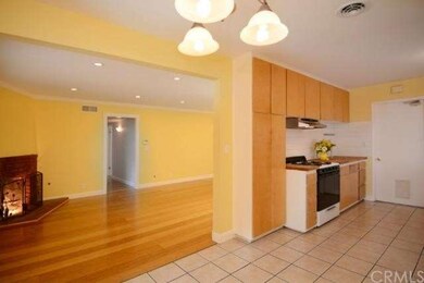 The living and dining rooms and kitchen share this