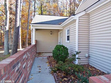 Exterior Front - Courtyard entry and covered porti