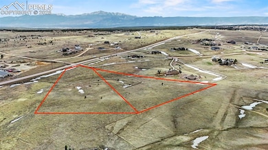 Birds eye view of property with a mountain view an