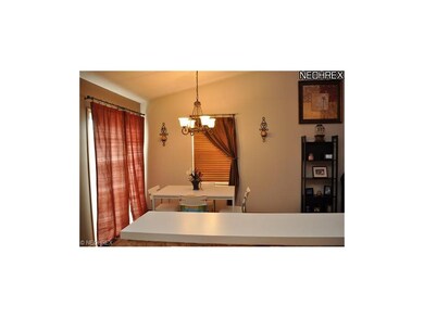 view from kitchen to dining area with breakfast ba