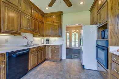 Bright kitchen with tons of Custom Cabinets built in's and Pantry