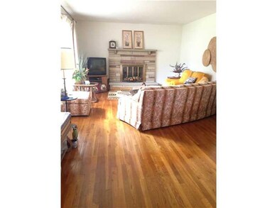Living Room. Beautiful hard wood floors and a wood