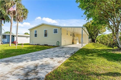 Front exterior of home with extra large Carport