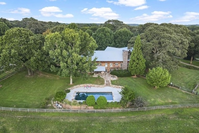 Pool with automatic cover, diving board,and views 