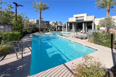 Community pool with a patio