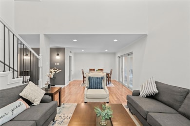 Living room featuring light wood-style flooring, c