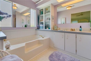 A soaker tub awaits you in the master bathroom.