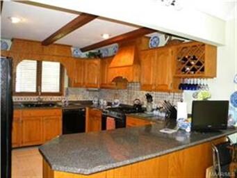 Kitchen has breakfast bar and separate breakfast a