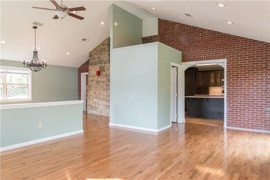 Exposed brick and the back of the stone fireplace 