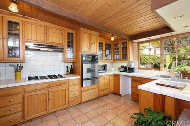Large and sun drenched kitchen overlooks the rear 