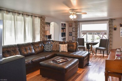 Spacious living room with large windows to allow for lots of natural light.