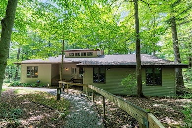 FRONT OF HOME WITH WALKWAY TO HOUSE
