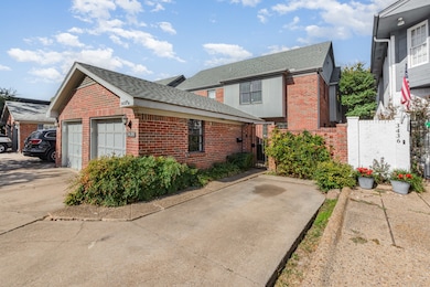 View of side of home with brick siding and roof with shingles