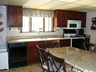 Kitchen. Custom Decorators refinished cabinets wit