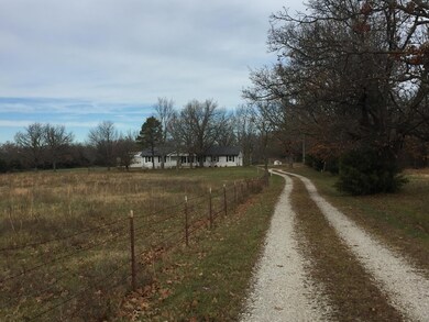 Front of house with pasture