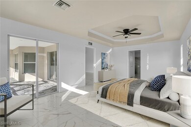 Bedroom featuring access to outside, a raised ceil