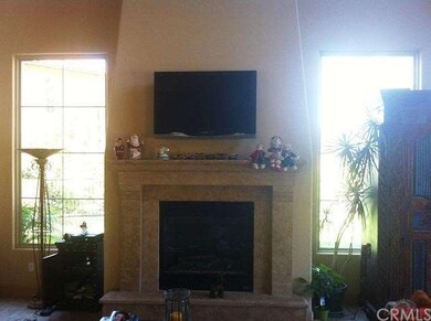 Floor to ceiling fireplace to warm the livingroom.