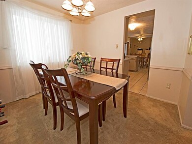 Neutral, warm and cozy formal dining room with cha