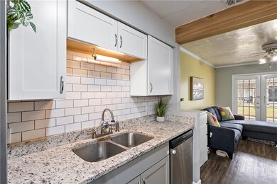 Kitchen with french doors, stainless steel dishwas