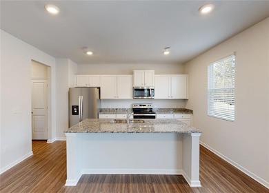 Kitchen with sink, stainless steel appliances, dar