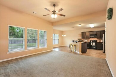Open living area to kitchen and dining.