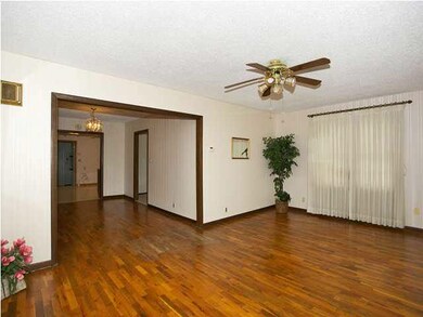 Living room view looking into dining room