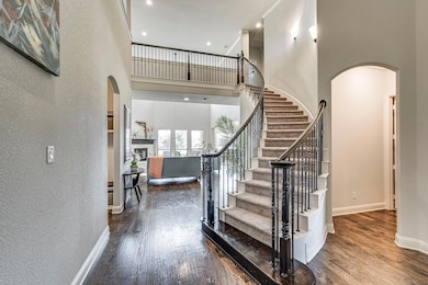 This grand staircase, beautiful arched doorways  a
