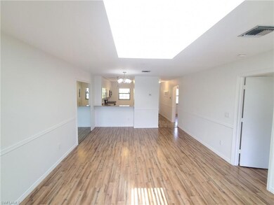 Unfurnished room with light hardwood / wood-style 