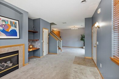 Welcome! Light, bright, and open main floor living with great fireplace and built-ins open to formal dining. Big space with updated lighting.