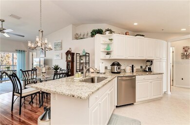 Gorgeous white kitchen with granite countertops, s