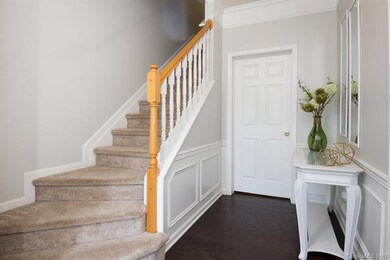 New wide-plank hardwoods make an inviting foyer.