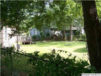 Fenced rear yard that includes a deck