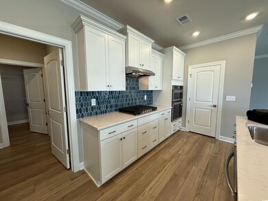 Kitchen with appliances with stainless steel finis