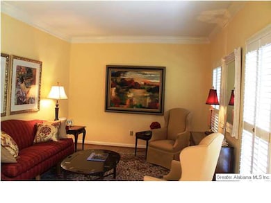 Living Room has crown molding and beautiful hardwo