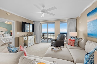 Living area featuring crown molding, light colored carpet, a ceiling fan, and a chandelier