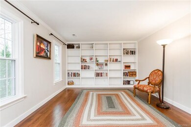 Formal living room/library with beautiful solid wo