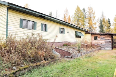 View of property exterior featuring a yard