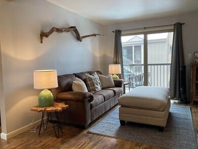 Living room featuring dark hardwood / wood-style f