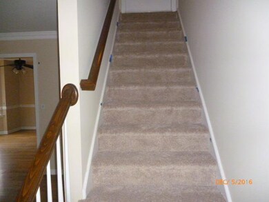 Stairs to upper level, over 1200 SF that could easily be finished.