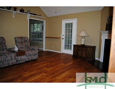 Den/Family/Great Room. Storm Door to Fenced Yard