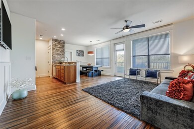 Living area featuring visible vents, baseboards, 
