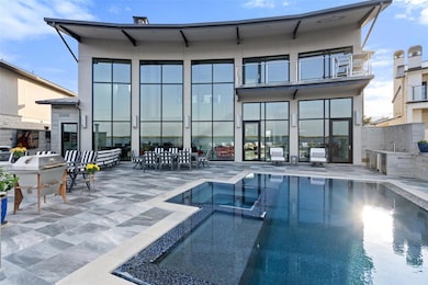 Back of property featuring stucco siding, a patio