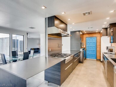 Modern kitchen with steel countertops, dbl oven &