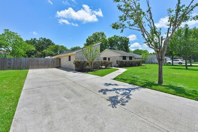 Unique for this area, this home offers a double-wide driveway that leads along the left side of the home to a cedar gate that opens to a bonus parking pad and a detached 2-car garage. Lots of concrete space for playing or for parking!