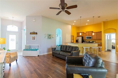 Family room with upgraded fan and luxury wood lami