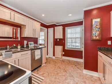 Updated kitchen with tile floors, updated cabinets