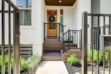 Charming front porch entry with gated front yard.